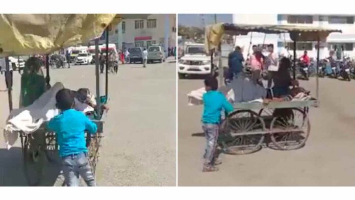Heart breaking video of boy carrying his dad on handcart to hospital