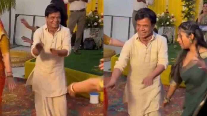Rajpal Yadav dancing in beige kurta at niece mehendi ceremony.