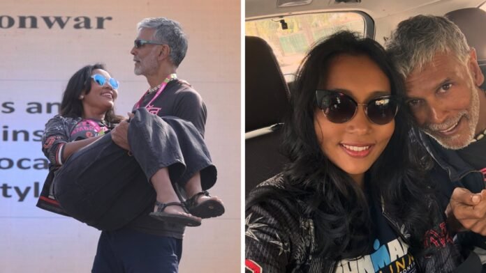 Milind Soman and Ankita Konwar smiling together at a public event